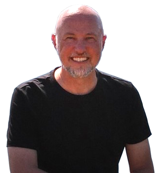 a bald man smiling with a grey beard and wearing a black tshirt on a white background